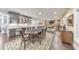 Open-concept game room with card table, bar, pool table, and hardwood floors at 1438 Kings Park Nw Dr, Kennesaw, GA 30152