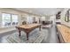 This game room has a pool table, shuffleboard, wet bar, and views to the outdoor entertaining area at 1438 Kings Park Nw Dr, Kennesaw, GA 30152