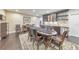The expansive game room features a poker table and wet bar with dark hardwood floors and recessed lighting at 1438 Kings Park Nw Dr, Kennesaw, GA 30152