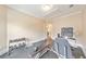 Bright home gym featuring exercise equipment, dumbbells, and a doorway leading to another room at 1438 Kings Park Nw Dr, Kennesaw, GA 30152