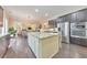 Modern kitchen with stainless steel appliances, granite counters, and a central island at 1438 Kings Park Nw Dr, Kennesaw, GA 30152