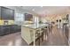 Beautiful kitchen with an island, hardwood floors, granite countertops, stainless steel appliances, and dark wood cabinets at 1438 Kings Park Nw Dr, Kennesaw, GA 30152