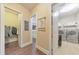 Bright laundry room featuring modern washer and dryer, storage shelves, and a convenient utility sink at 1438 Kings Park Nw Dr, Kennesaw, GA 30152