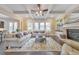 Spacious living room featuring a fireplace, built-ins, and ample seating, perfect for entertaining guests and relaxing at 1438 Kings Park Nw Dr, Kennesaw, GA 30152