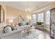 Bright living room featuring a bay window, neutral decor, and a cozy seating arrangement at 1438 Kings Park Nw Dr, Kennesaw, GA 30152