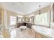 Luxury main bathroom features dual vanities, soaking tub, and elegant fixtures at 1438 Kings Park Nw Dr, Kennesaw, GA 30152