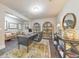 Expansive home office with hardwood floors, comfortable seating, and stylish bookshelves at 1438 Kings Park Nw Dr, Kennesaw, GA 30152