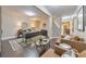Spacious home office with hardwood floors, modern desk, and comfortable seating area at 1438 Kings Park Nw Dr, Kennesaw, GA 30152