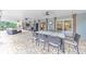 Covered outdoor patio featuring a dining area with ceiling fans and views to the yard at 1438 Kings Park Nw Dr, Kennesaw, GA 30152