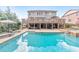 Relaxing backyard with a sparkling pool, hot tub, and elevated deck, perfect for outdoor entertaining at 1438 Kings Park Nw Dr, Kennesaw, GA 30152
