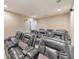 Home theater room with rows of comfortable leather recliners and overhead lighting at 1438 Kings Park Nw Dr, Kennesaw, GA 30152