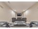 Home theater room with rows of comfortable leather seating and a large flat-screen television at 1438 Kings Park Nw Dr, Kennesaw, GA 30152