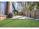 A cozy backyard featuring a patio and artificial turf, perfect for outdoor gatherings and low-maintenance enjoyment at 3650 Dogwood Farm Rd, Decatur, GA 30034