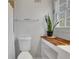 Bathroom with a toilet, window, and wood countertop at 3650 Dogwood Farm Rd, Decatur, GA 30034