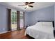 Bedroom with light blue walls and hardwood floors at 3650 Dogwood Farm Rd, Decatur, GA 30034