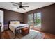 Bedroom featuring warm wall colors, wood floors and backyard view at 3650 Dogwood Farm Rd, Decatur, GA 30034
