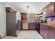 Charming kitchen features stainless steel appliances, hexagon tile floor, and modern countertops at 3650 Dogwood Farm Rd, Decatur, GA 30034