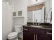 Modern bathroom with dark wood vanity, granite countertop, and shower with curtain at 659 Auburn Avenue Ne #219, Atlanta, GA 30312