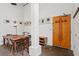 Inviting entrance featuring a rustic wooden door, art, and dining area at 659 Auburn Avenue Ne #219, Atlanta, GA 30312