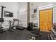 Well-equipped gym featuring a treadmill, bike, weights, and a TV, offering residents a convenient fitness space at 659 Auburn Avenue Ne #219, Atlanta, GA 30312
