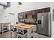 Modern kitchen featuring stainless steel appliances and a butcher block island with seating at 659 Auburn Avenue Ne #219, Atlanta, GA 30312