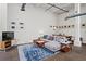 Stylish living room features concrete floors, neutral tones and open layout at 659 Auburn Avenue Ne #219, Atlanta, GA 30312