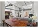 Open-concept living area with exposed pipes, modern kitchen, and cozy seating at 659 Auburn Avenue Ne #219, Atlanta, GA 30312