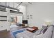 Modern living room design with concrete floors and access to an outdoor balcony at 659 Auburn Avenue Ne #219, Atlanta, GA 30312