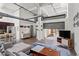 Open-concept living space with stainless steel appliances and concrete flooring at 659 Auburn Avenue Ne #219, Atlanta, GA 30312