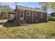Back exterior showcasing brick home with a screened porch and a cozy back entrance at 854 Slaton St, Forest Park, GA 30297