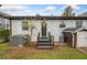 Spacious backyard with grass, small shed, patio, and access to the home's back entrance at 1780 John Calvin Ave, Atlanta, GA 30337