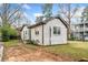 The backyard features a grassy yard and mature trees, highlighting the outdoor living space at 1780 John Calvin Ave, Atlanta, GA 30337