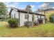 Backyard area features grassy yard, storage shed, and mature shade trees at 1780 John Calvin Ave, Atlanta, GA 30337