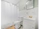 Bright bathroom with a shower, white tile, and modern fixtures at 1780 John Calvin Ave, Atlanta, GA 30337
