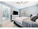 Primary bedroom with a ceiling fan, natural light and a modern dresser at 1780 John Calvin Ave, Atlanta, GA 30337