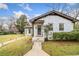 Charming white brick home with inviting walkway lighting and well-maintained lawn at 1780 John Calvin Ave, Atlanta, GA 30337