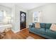 Bright living room with hardwood floors, comfortable seating, and plenty of light at 1780 John Calvin Ave, Atlanta, GA 30337