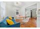 Living room and dining area combined offering ample seating and hardwood floors at 1780 John Calvin Ave, Atlanta, GA 30337