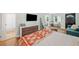 Open-concept room with bedroom area with stylish dresser and adjacent bathroom at 1780 John Calvin Ave, Atlanta, GA 30337