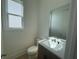 Bright half-bathroom features modern sink and fixtures for a functional and stylish space at 2155 Suncrest Point, Marietta, GA 30064