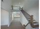 Spacious entryway with soaring ceilings, wood floors, and staircase leading to second floor landing at 2155 Suncrest Point, Marietta, GA 30064