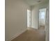 Hallway with hardwood floors leading to bathroom, enhancing the home's modern and cohesive design at 2155 Suncrest Point, Marietta, GA 30064