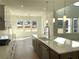 Modern kitchen with stainless steel appliances, island, and hardwood floors provides a welcoming culinary space at 2155 Suncrest Point, Marietta, GA 30064