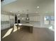 Modern kitchen with quartz countertops, stainless steel appliances, and eat-in island at 2155 Suncrest Point, Marietta, GA 30064
