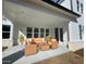 Inviting covered patio features comfortable seating and provides an ideal outdoor relaxation space at 2155 Suncrest Point, Marietta, GA 30064
