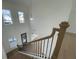 Bright staircase with decorative metal spindles that overlooks the foyer and front entryway at 2155 Suncrest Point, Marietta, GA 30064