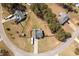 Aerial view of a home in a neighborhood with mature trees, a circular street, and large lots at 248 Christian Circle, Carrollton, GA 30116