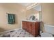Bathroom featuring a double vanity with a large mirror and tiled floors at 248 Christian Circle, Carrollton, GA 30116