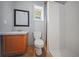 Practical bathroom featuring a white-tiled shower, neutral walls, and a vanity at 248 Christian Circle, Carrollton, GA 30116