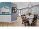 Eat-in kitchen/dining area with decorative lighting, stainless appliances, and a breakfast bar at 248 Christian Circle, Carrollton, GA 30116